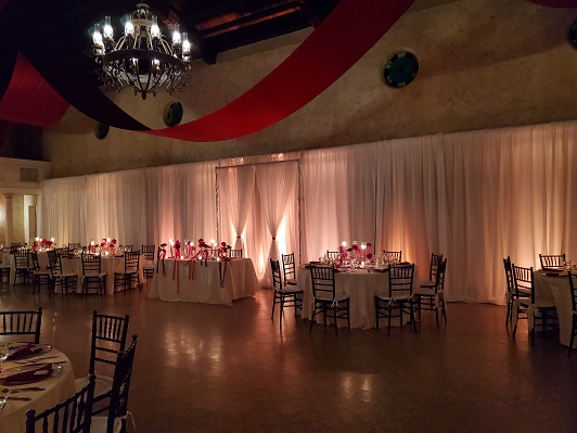 Ballroom draping with amber lighting