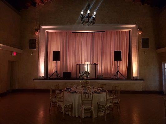 Stage backdrop with draping and back lighting