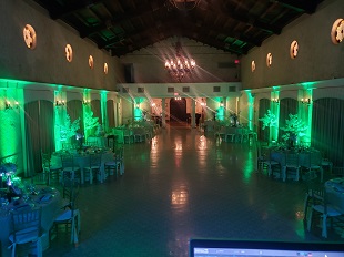 Green up-lighting on ballroom walls