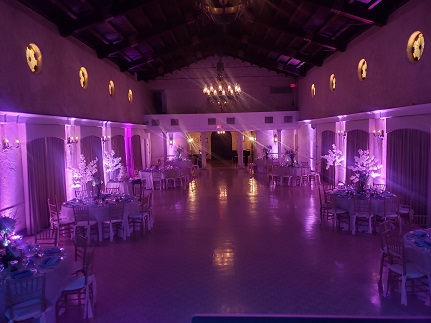 Lavender up-lighting in ballroom